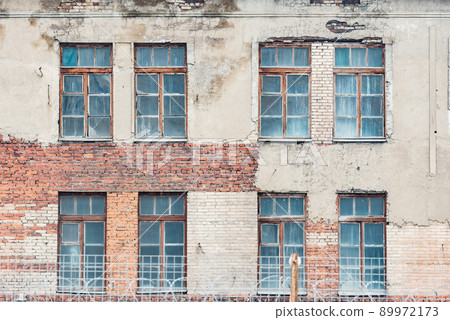Concrete fence with barbed wire of the prison. 89972173