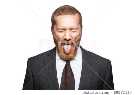 Crazy businessman with clossed eyes and tongue. isolated on white, looking at camera. Crazy businessman with clossed eyes and tongue. isolated on white, looking at camera. 89972183
