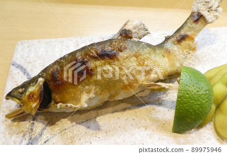 Grilled sweetfish with salt in summer in Japan Grilled sweetfish with salt in summer in Japan 89975946