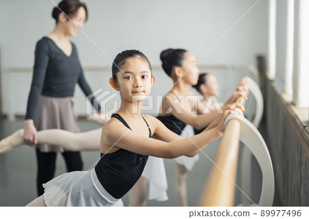 Ballet classroom teacher and children Ballet classroom teacher and children 89977496