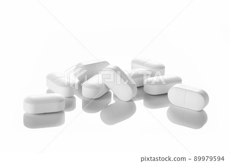 Background of white tablets or pills on blue table. Medicine and pharmacy 89979594