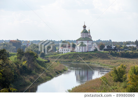 The Church of Elijah the Prophet was built in 1744 and is located in the bend of the Kamenka River, opposite the Suzdal Kremlin. Religion concept. Suzdal, Vladimir region, Russia - SEPTEMBER 12, 2021 The Church of Elijah the Prophet was built in 1744 and is located in the bend of the Kamenka River, opposite the Suzdal Kremlin. Religion concept. Suzdal, Vladimir region, Russia - SEPTEMBER 12, 2021 89980860