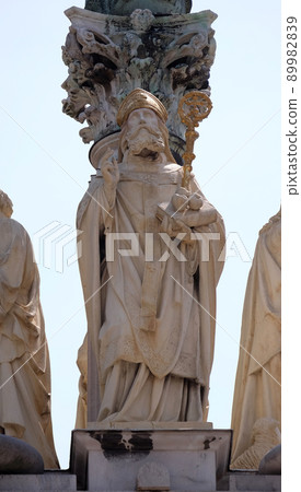 St. Nicholas, statue on the St. Mary pillar in front of Saint James church in Ljubljana, Slovenia 89982839