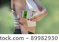 Diabetic woman monitoring and checking glucose level with a remote sensor and a new technology with an app in smartphone 89982930