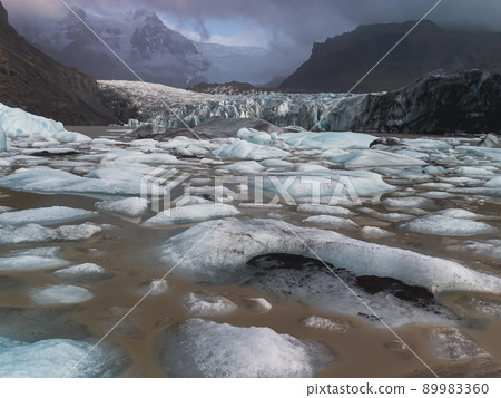 Massive glacier tongue end melt down with icebergs Massive glacier tongue end melt down with icebergs 89983360