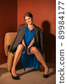 young girl posing at camera, full length portrait 89984177