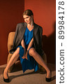 young girl posing at camera, full length portrait 89984178