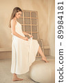 young girl lifted her dress and bared her leg 89984181