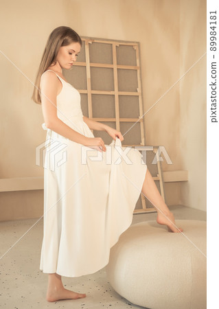 young girl lifted her dress and bared her leg young girl lifted her dress and bared her leg 89984181