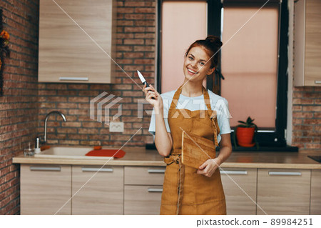 a housewife houses in the kitchen cutting board with knife apartments home life 89984251