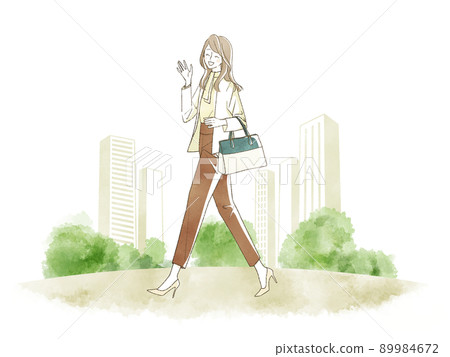 Woman walking with a smile Woman walking with a smile 89984672
