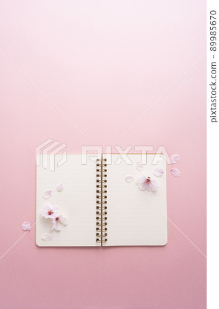Cherry blossom petals and ring notes Cherry blossom petals and ring notes 89985670