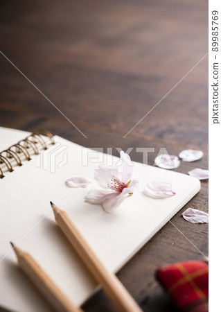 Cherry petals and ring notes and pencils Cherry petals and ring notes and pencils 89985769