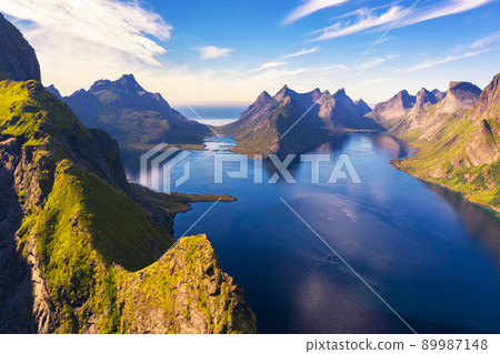 Aerial view of mountains and fjords around Reine in Lofoten islands, Norway Aerial view of mountains and fjords around Reine in Lofoten islands, Norway 89987148