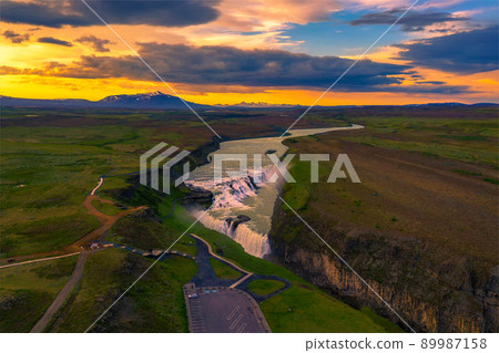 Aerial view of sunset over Gullfoss waterfall and the Olfusa river in Iceland Aerial view of sunset over Gullfoss waterfall and the Olfusa river in Iceland 89987158