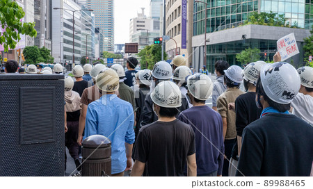 Demonstrators and police officers marching while calling Spreichk Demonstrators and police officers marching while calling Spreichk 89988465