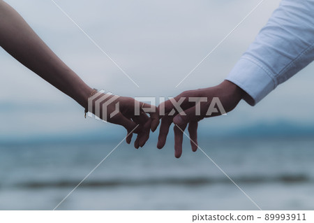 Male and female joining hands 89993911