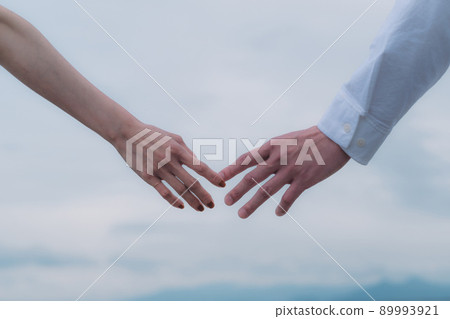 Male and female joining hands 89993921