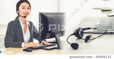 Business people wearing headset working in office broaden view 89994233