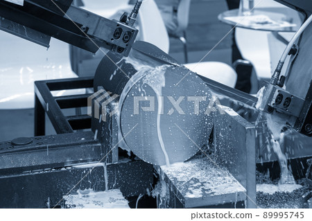 The automatic band saw machine cutting the metal rod with water base coolant method. The automatic band saw machine cutting the metal rod with water base coolant method. 89995745