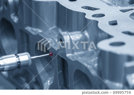 The multi-axis CMM machine measuring the cylinder head parts . 89995759