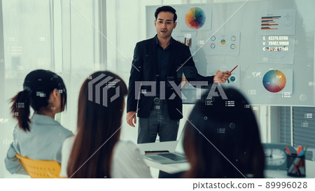 Business people in corporate staff meeting with envisional graphic 89996028