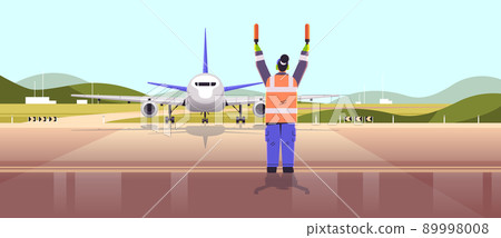 aviation marshaller supervisor in uniform navigate with light sticks air traffic controller airline worker in signal vest 89998008