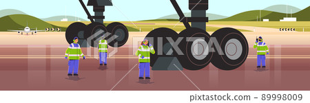 aviation marshallers in uniform using walkie talkie air traffic controllers airline worker in signal vests professional airport staff aviation marshallers in uniform using walkie talkie air traffic controllers airline worker in signal vests professional airport staff 89998009