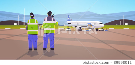 aviation marshallers supervisors in uniform using walkie talkie air traffic controllers airline worker in signal vests professional airport staff 89998011