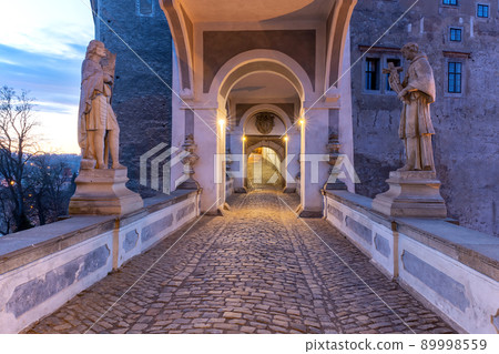 Vew of the covered bridge in Cesky Krumlov castle in the sunrise. Vew of the covered bridge in Cesky Krumlov castle in the sunrise. 89998559