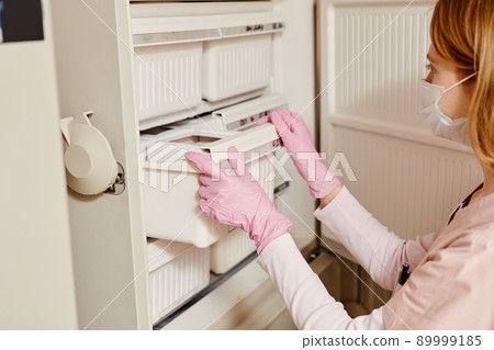 Nurse Storing Samples Nurse Storing Samples 89999185