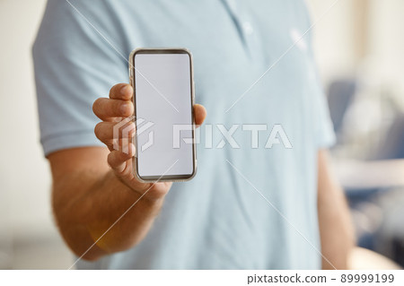Man Holding Blank Smartphone 89999199