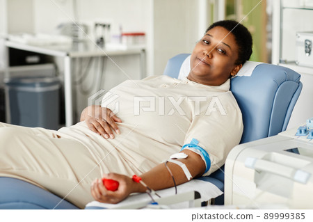 Smiling Woman at Blood Donation Center 89999385