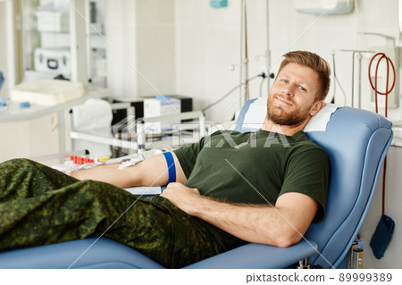 Smiling Military Man at Blood Donation Center Smiling Military Man at Blood Donation Center 89999389