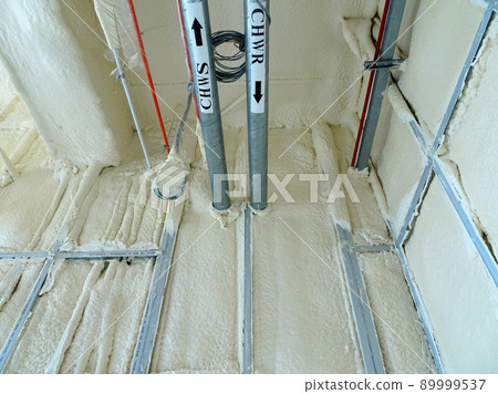 SELANGOR, MALAYSIA - MARCH 10, 2022: Polyurethane insulating foam that has been sprayed and covered the concrete slabs and walls surface. Serves as a layer of thermal insulation for the building. SELANGOR, MALAYSIA - MARCH 10, 2022: Polyurethane insulating foam that has been sprayed and covered the concrete slabs and walls surface. Serves as a layer of thermal insulation for the building. 89999537