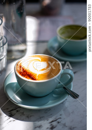 Latte or Cappuccino Coffee in cafe 90001783