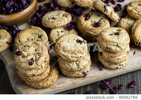 delicious dried cookies made of high-quality flour with dried red cranberries on the table 90002766