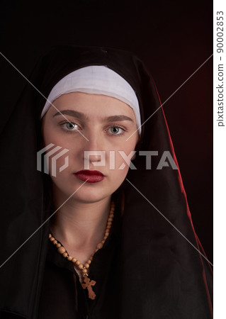 Portrait of a young caucasian christian nun sister girl. 90002853
