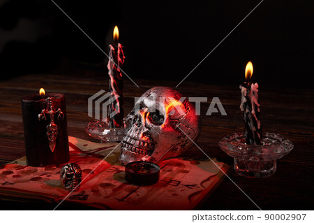 Still life skull with candles and other acccessories for sataic ritual . Still life skull with candles and other acccessories for sataic ritual . 90002907