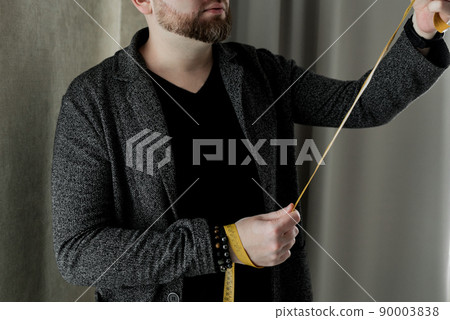 bearded Tailor in his workshop 90003838