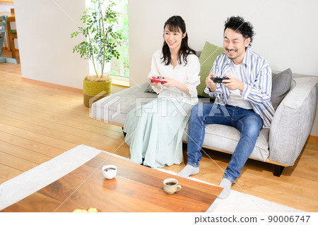 Also for the main visual! Couple enjoying the game 90006747