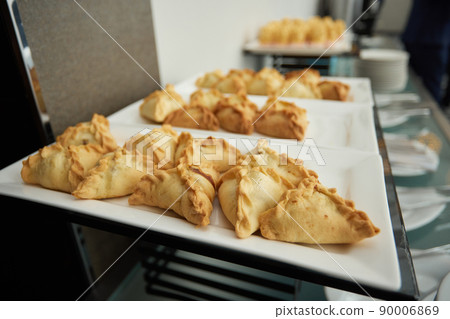 Triangular pies on a plate uchpochmak catering. 90006869