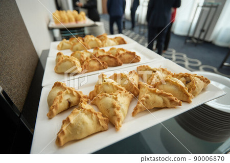 Triangular pies on a plate uchpochmak catering. 90006870