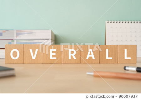 Desk with building blocks with "OVERALL" written on it Desk with building blocks with "OVERALL" written on it 90007937