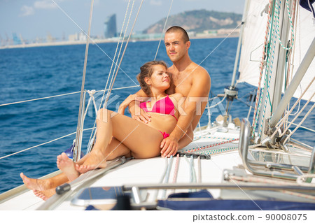 Woman and man enjoying sea travel along shoreline of Spain Woman and man enjoying sea travel along shoreline of Spain 90008075