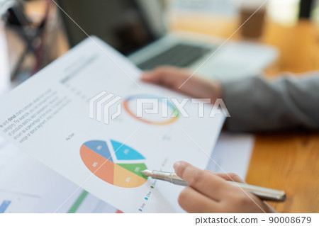 Business analyst concept the data analyst comparing the charts of the recent year and this year on the document Business analyst concept the data analyst comparing the charts of the recent year and this year on the document 90008679