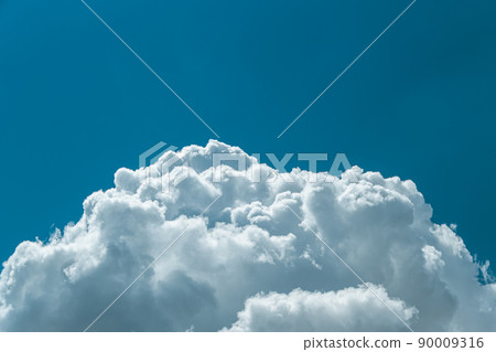 Blue sky with puffy clouds for background. Atmospheric phenomena in formation of precipitation. Blue sky with puffy clouds for background. Atmospheric phenomena in formation of precipitation. 90009316