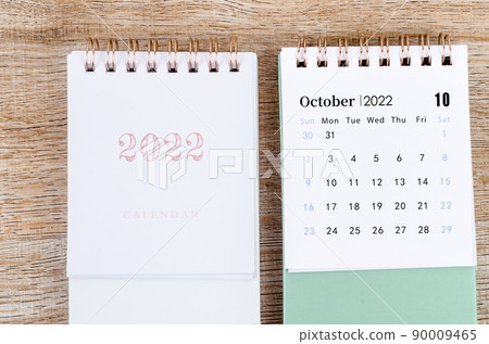 October 2022 desk calendar on wooden background. October 2022 desk calendar on wooden background. 90009465