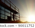 the silhouette of construction workers. 90011752