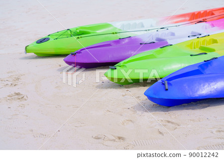 sea kayaks or multicolor boat on beautiful beach in Thailand sea kayaks or multicolor boat on beautiful beach in Thailand 90012242